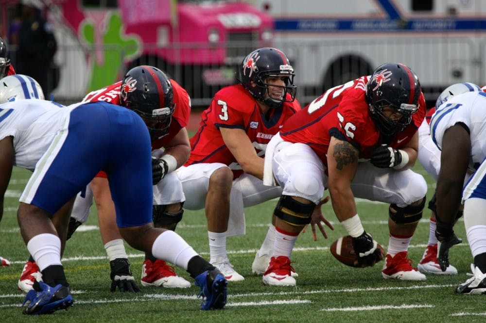Spider QB Michael Strauss takes the snap during Richmond's defeat of the Hampton Pirates.