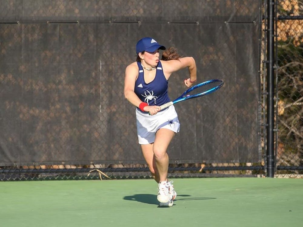 Junior Marta Buendia runs at the March 25 matches against George Mason University at the Westhampton Tennis Courts, where went undefeated. Photo courtesy of Richmond Athletics.&nbsp;