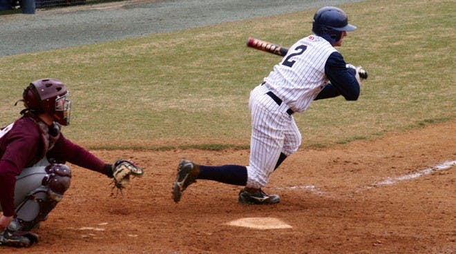 Adam McConnell hits the ball