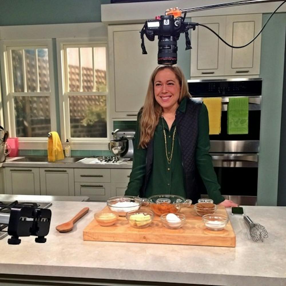 <p>Ashley Foxen filming her Food Network show "Reality Cupcakes." <em>Photo courtesy of Ashley Foxen.</em>&nbsp;</p>