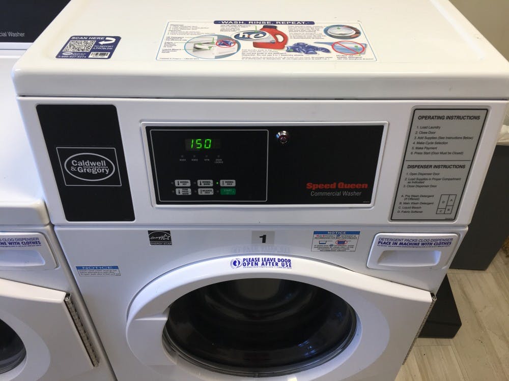 The Caldwell &amp; Gregory service number is located on the top left of this washing machine in North Court.&nbsp;