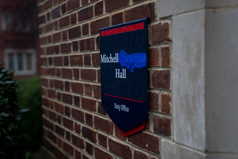 <p>The miniature signage surrounding Mitchell-Freeman hall remains, with the word "Freeman" blocked out with blue paint.</p>