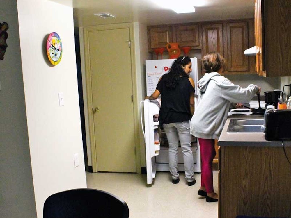 Sophomore Karin Eastby, 19, of Hampton-Sydney, Va., and sophomore Amanda Kleintop, also 19, of Philadelphia, after the final presidential debate Wednesday night. (Dan Petty/The Collegian)