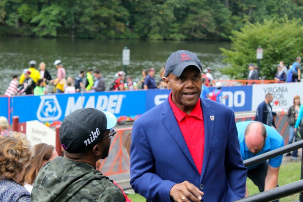 <p>Ronald Crutcher speaking with a member of the Richmond community last fall.&nbsp;</p>