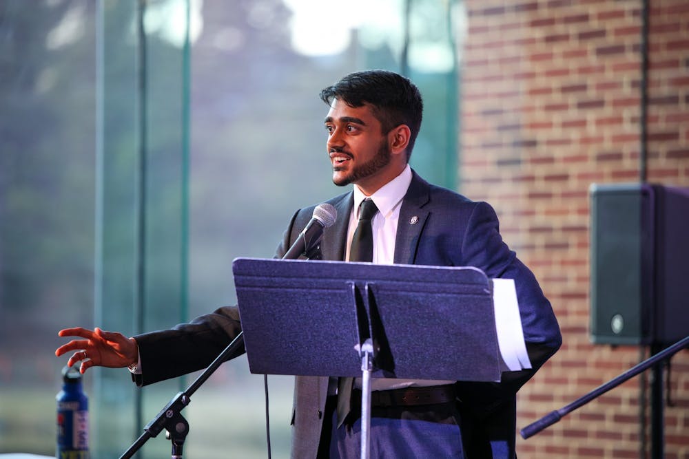 <p>Richmond College Student Government Association President-elect junior Arju Patel addresses students in the March 21 debate at the Current.</p>