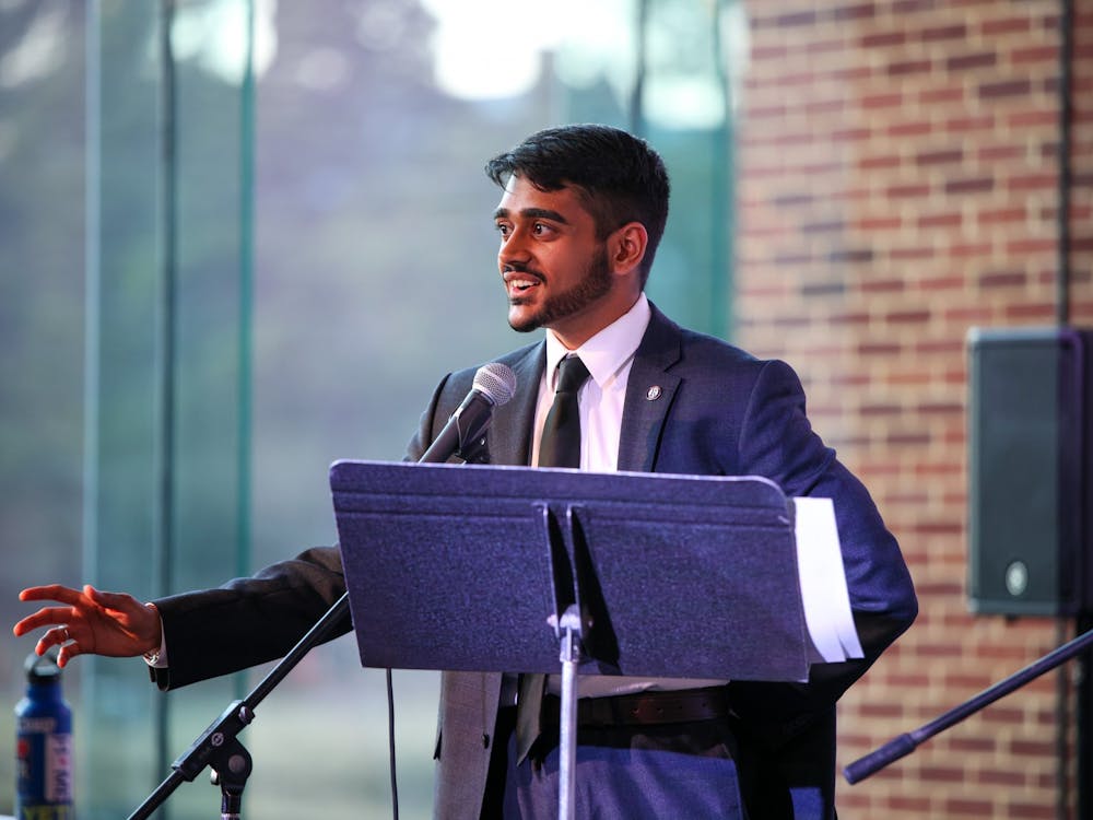 Richmond College Student Government Association President-elect junior Arju Patel addresses students in the March 21 debate at the Current.