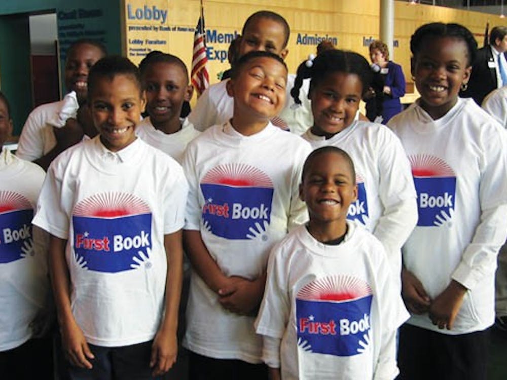 Kids participating at a first book community event at the childrens museum.