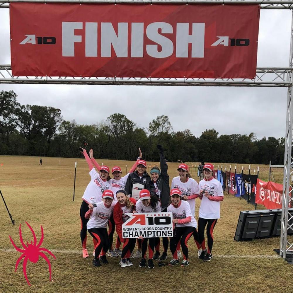 <p>The women's cross country team celebrates their Atlantic-10 Conference championship. <em>Photo courtesy of @spiderathletics Instagram.</em></p>