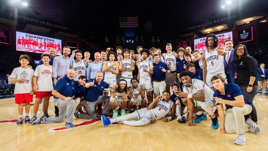 The Spiders celebrated their victory against Saint Joseph's University at the Robins Center on March 6. Courtesy of Richmond Athletics.