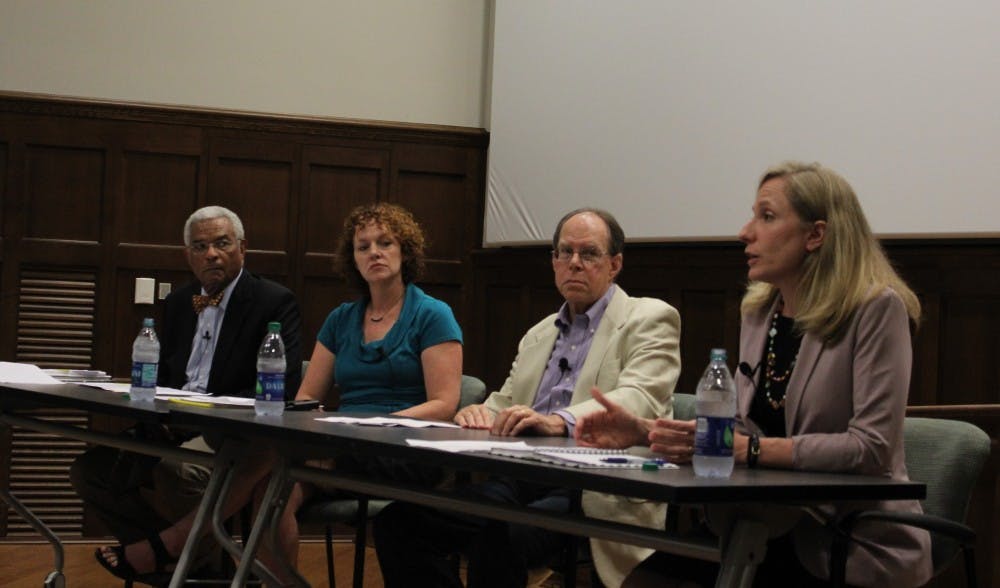 Democratic congressional candidate Abigal Spanberger, far left, speaks about the high cost of drugs as other panelists, from the right, Harry Bear, Tracy Roof and Larry Palmer listen.