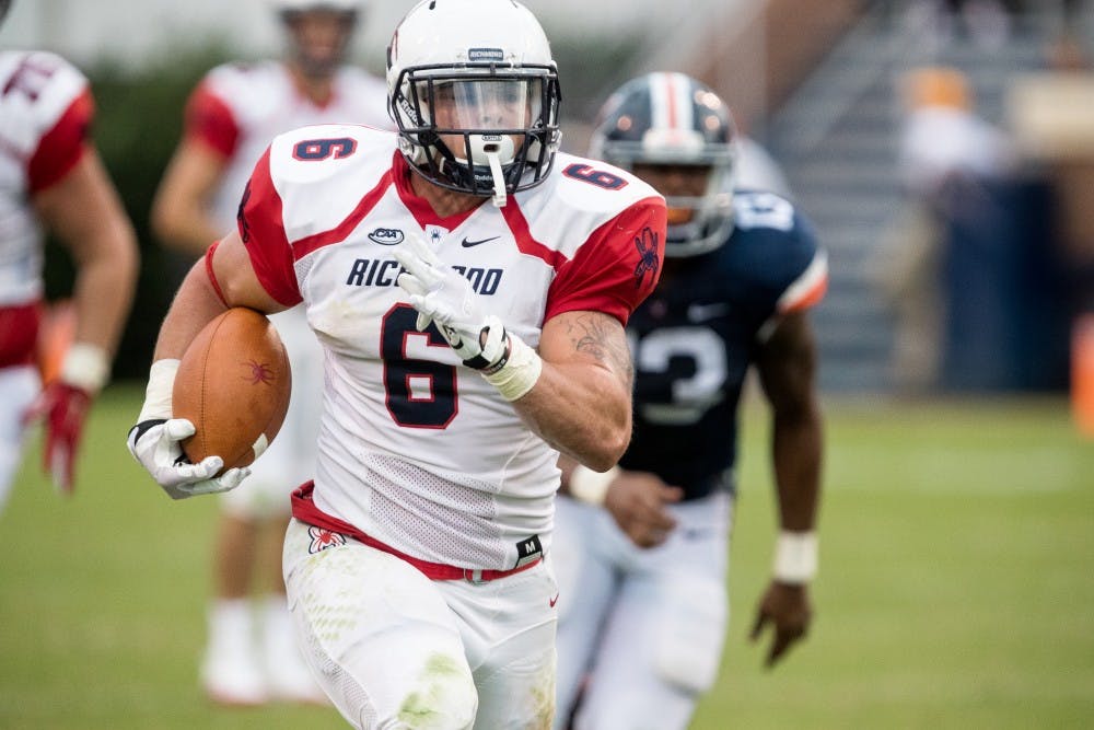 <p>Gordon Collins&nbsp;runs for a 55-yard touchdown in the fourth quarter of Saturday's Richmond win.&nbsp;</p>