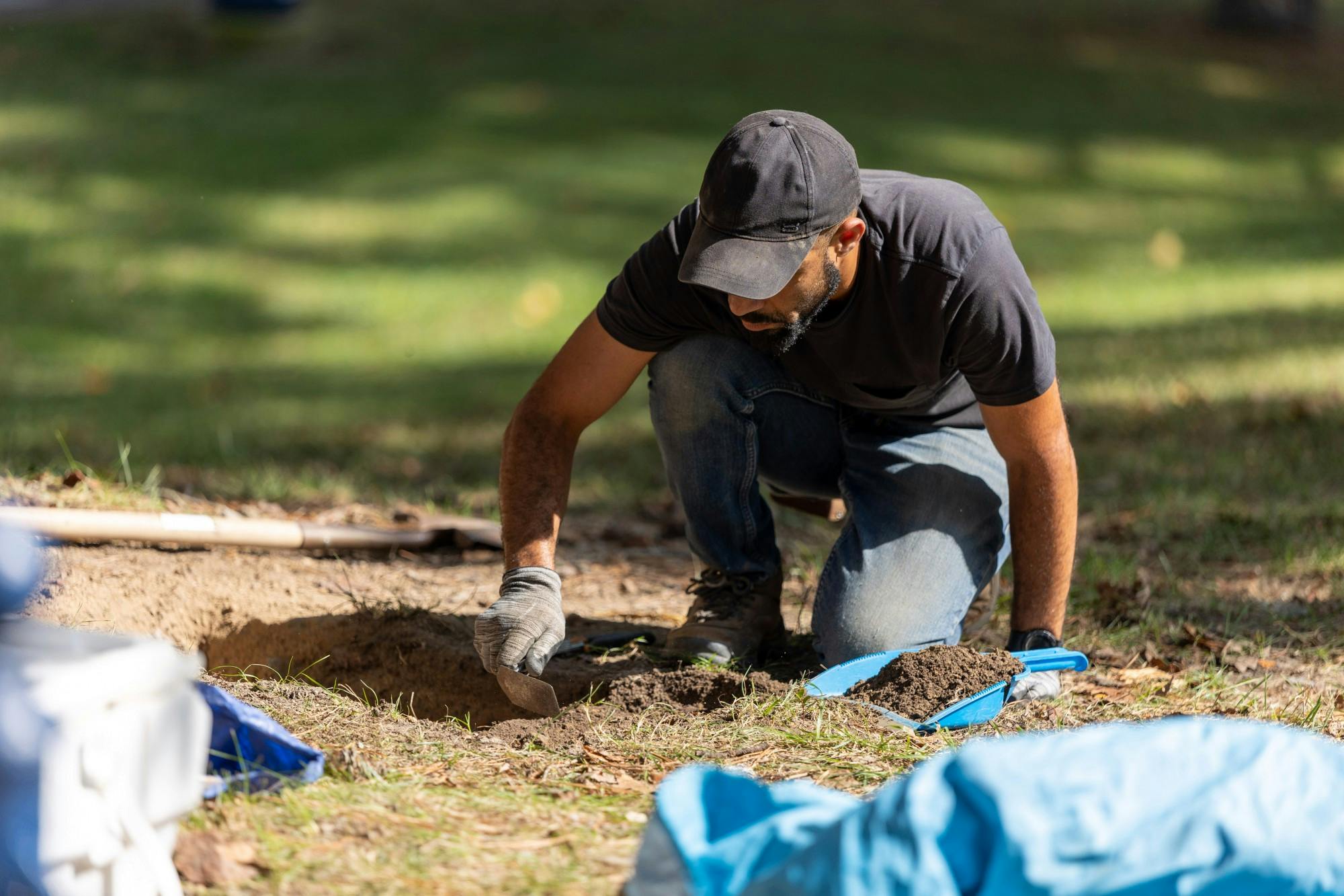 Archeologist Tim Roberts conducts fieldwork at the Westham Burying Ground on Sept. 14.