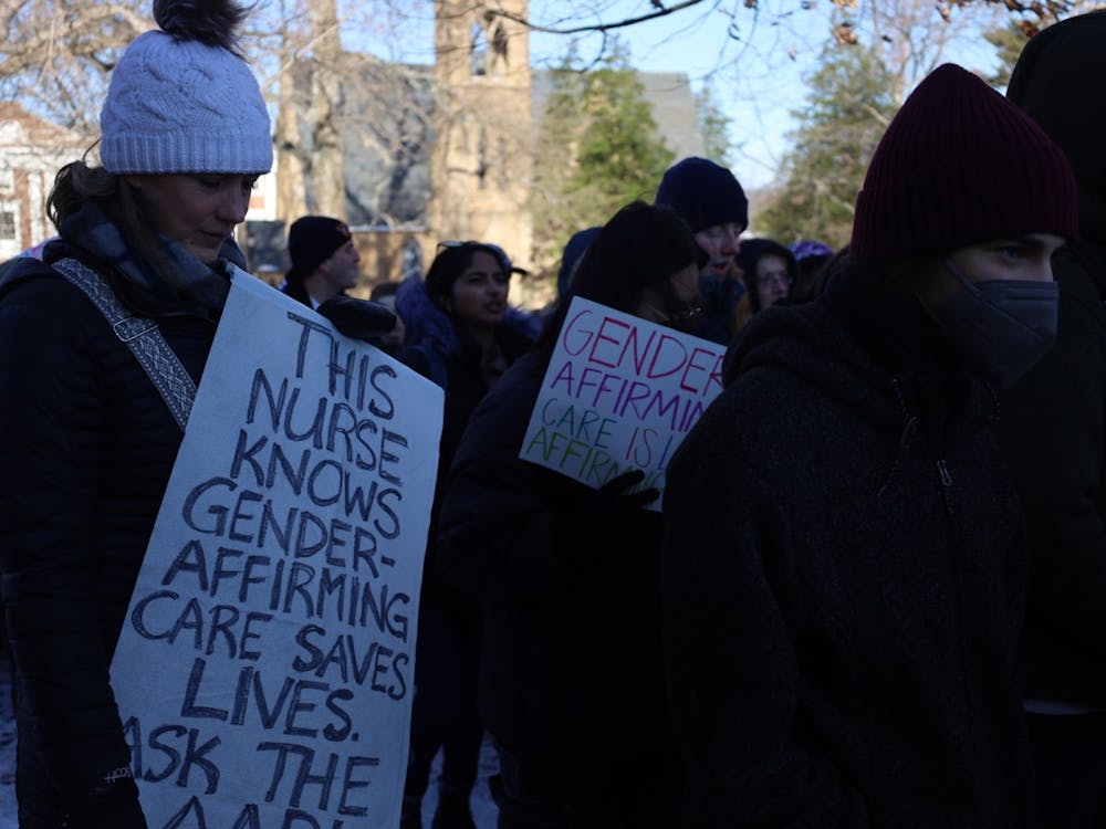 Nurses and others rally at the University of Virginia on behalf of gender-affirming care. 