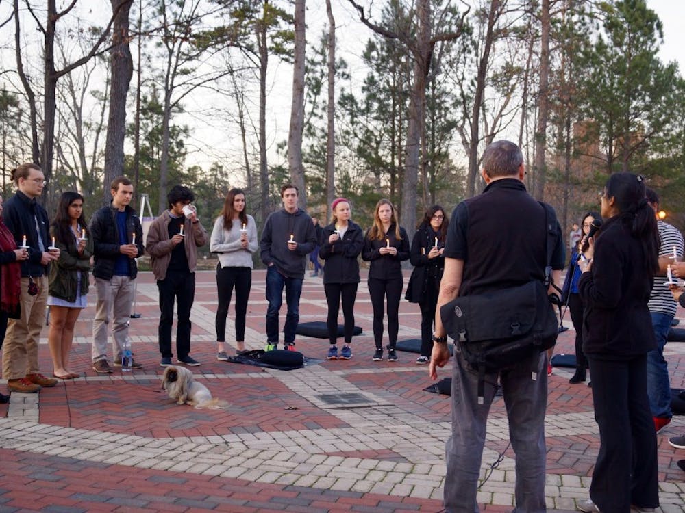 Harleen Bal (right corner) reads aloud the names of the 17 Parkland, FL, shooting victims at the silent sit-in. 