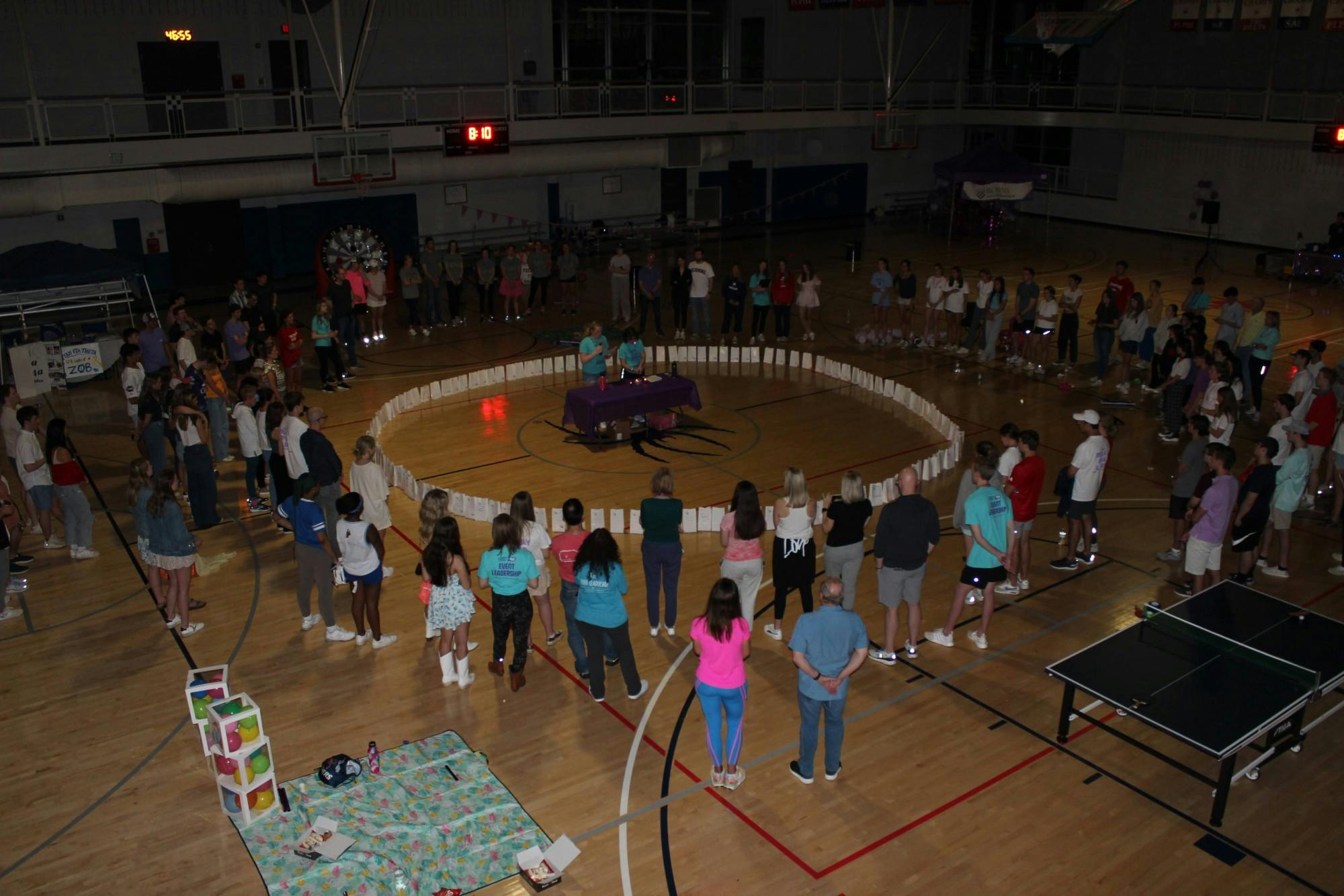 Relay for Life participants came together in a circle and dedicated a luminaria to a loved one who had or is currently fighting against cancer on April at the Weinstein Center for Recreation. Photo courtesy of Kate Amabile.&nbsp;