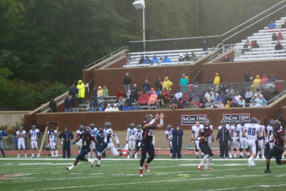 <p>Justin Rubin awaits an interception during the second quarter as the few poncho-covered fans look on. Richmond has been in control for the majority of the game. </p>