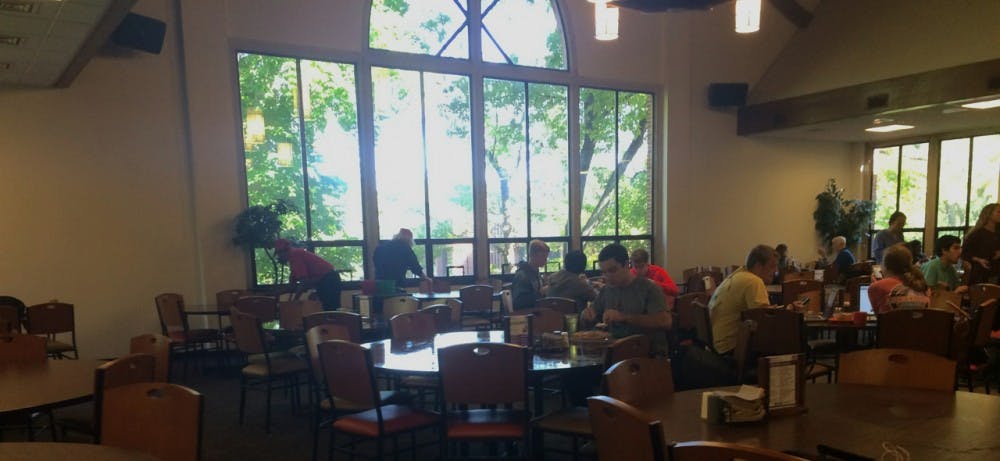 <p>Dining Hall employees from Supported Employment of Virginia work in the background cleaning tables.</p>