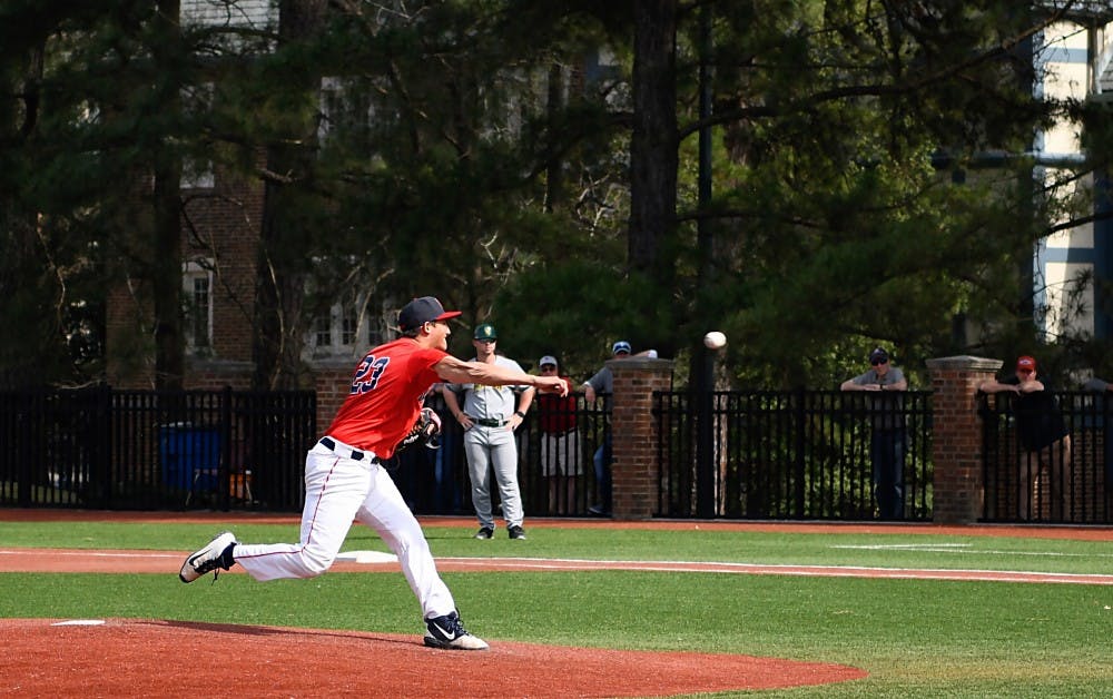 <p>Sophomore right-handed pitcher Jarrad Delarso pitches during the March 30 game against George Mason University.</p>