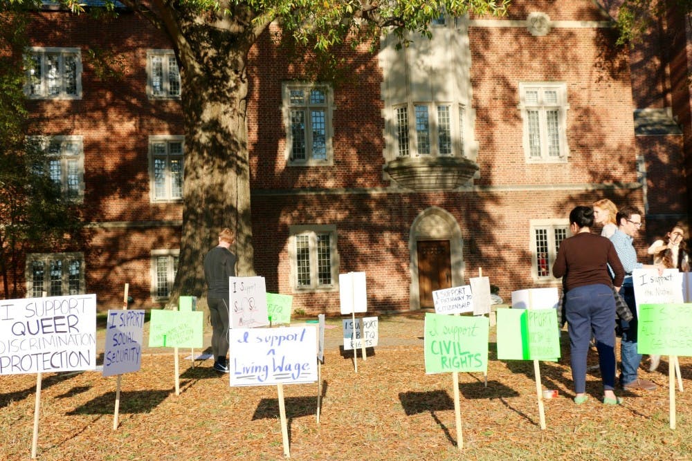 Students, faculty and staff organized outside Boatwright Memorial Library to positively protest the presidential election.