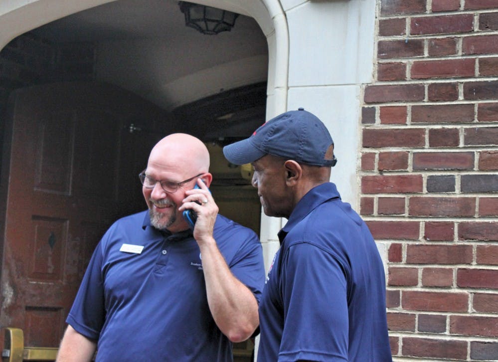 Richmond College Dean Joe Boehman (left) also helped students move in.