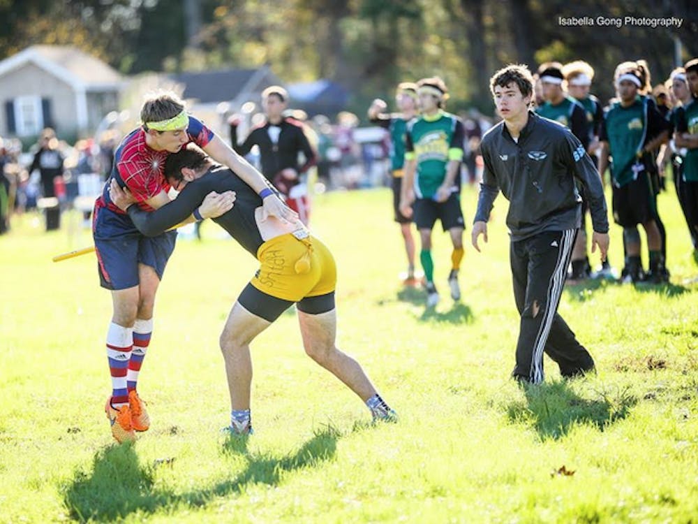 A University of Richmond Quidditch player engaged with the Golden Snitch.