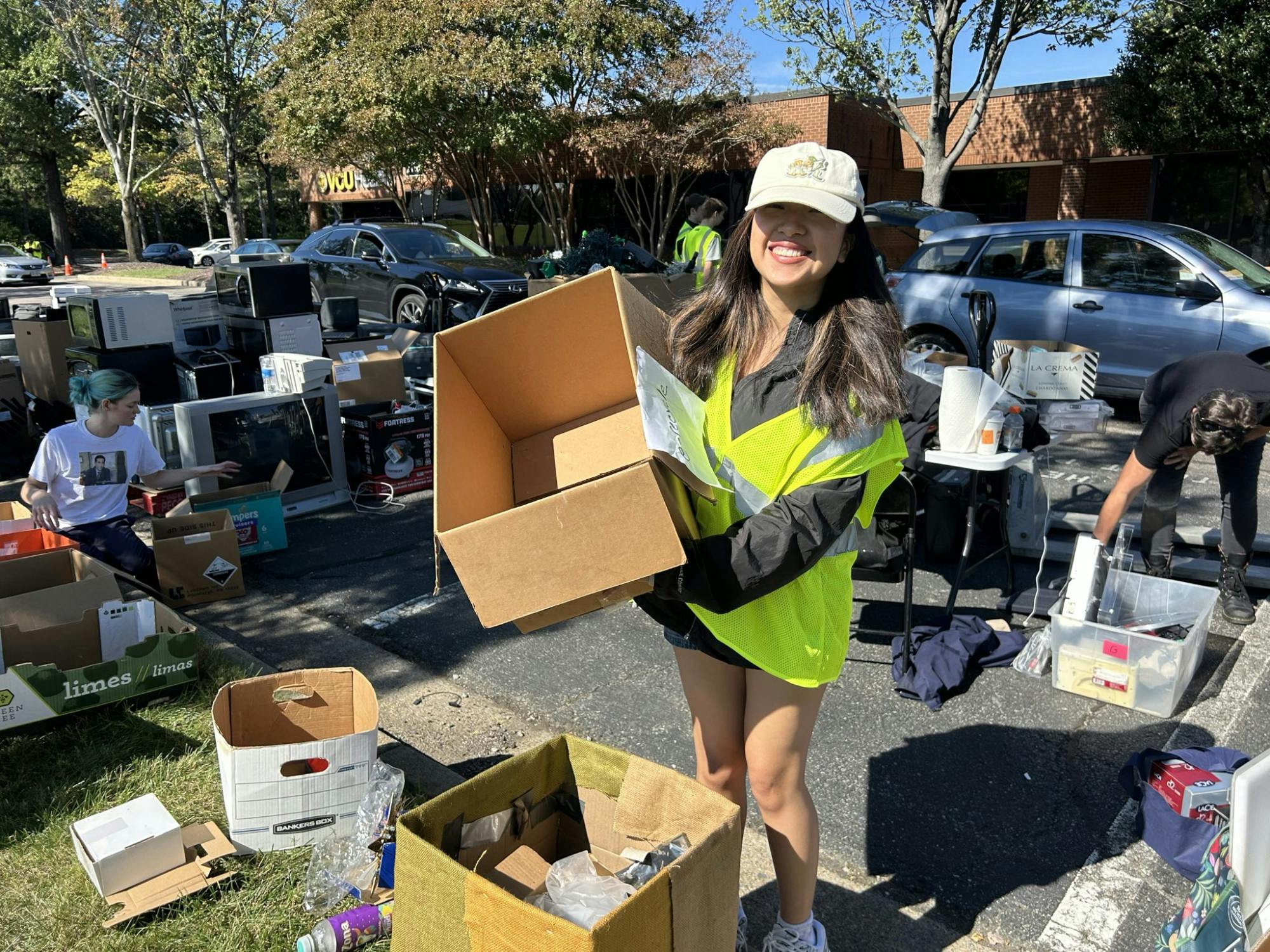 Sophomore Melissa Pacaja holds one of the boxes where recycled electronics were placed for sorting.