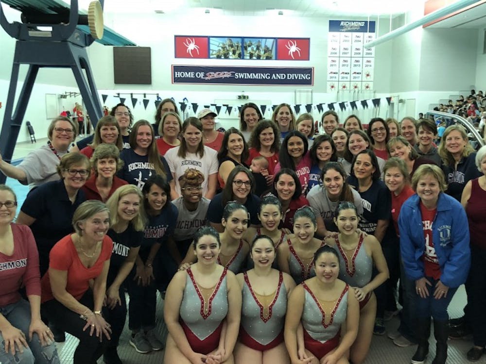 The synchronized swimming team surrounded by its coaches and alumae this past weekend.&nbsp;