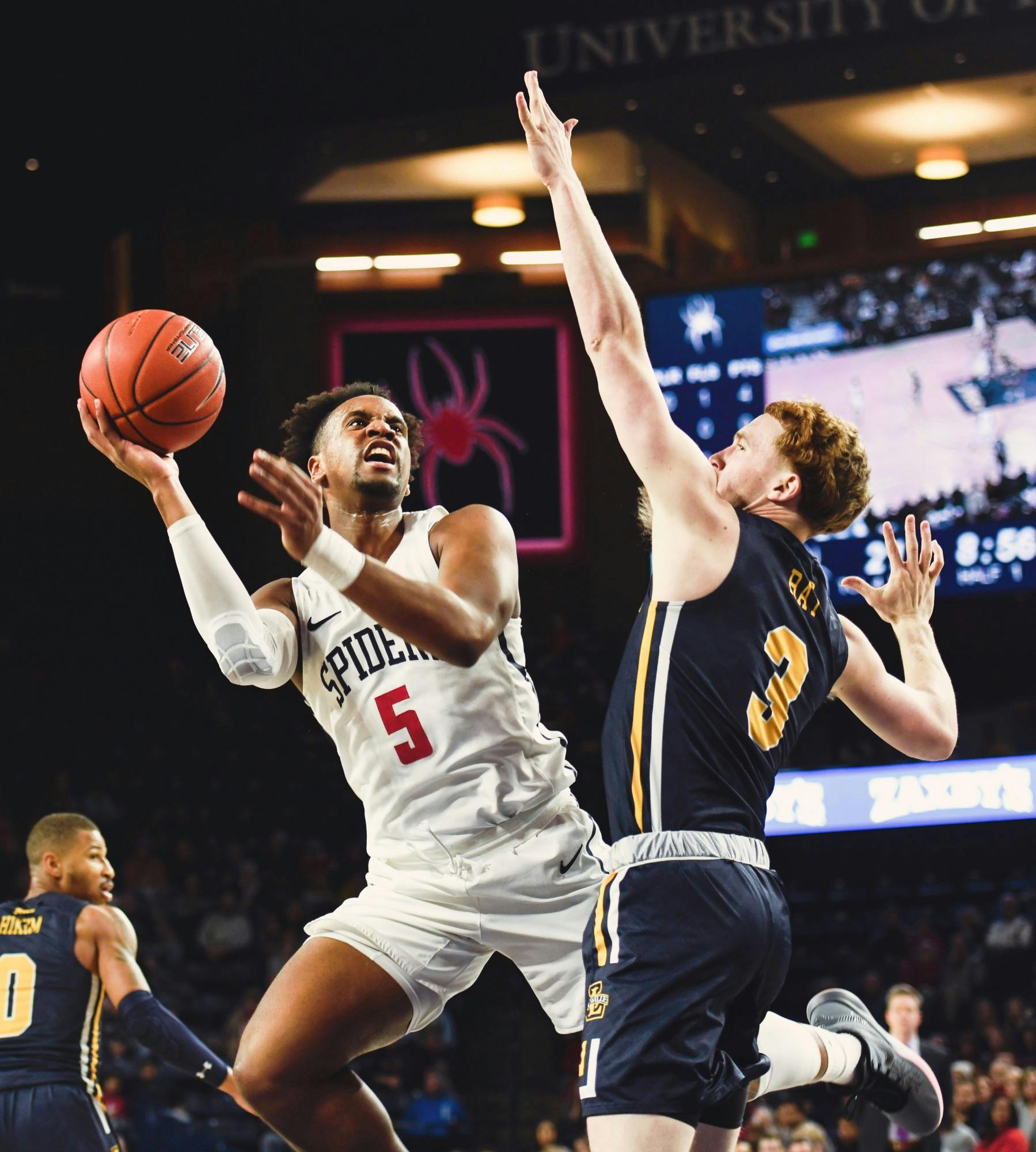 Redshirt junior guard Nick Sherod shoots past La Salle defense during a game at Robins Stadium on Wednesday, January 22, 2020.