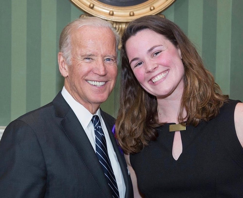 <p>Vice President Joe Biden takes photos with junior Rennie Harrison during an It's On Us and Violence Against Women Act reception held at the Naval Observatory Residence in Washington, D.C., Oct. 4, 2016.</p>