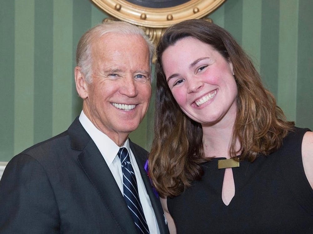 Vice President Joe Biden takes photos with junior Rennie Harrison during an It's On Us and Violence Against Women Act reception held at the Naval Observatory Residence in Washington, D.C., Oct. 4, 2016.