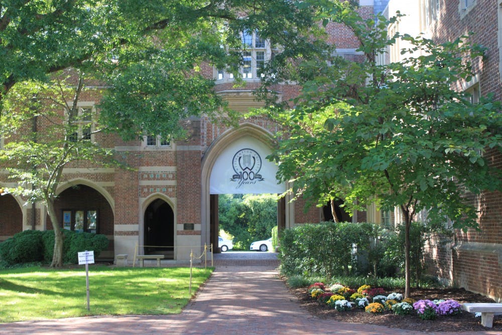 A Westhampton banner hangs in an archway in North Court in honor of the centennial.