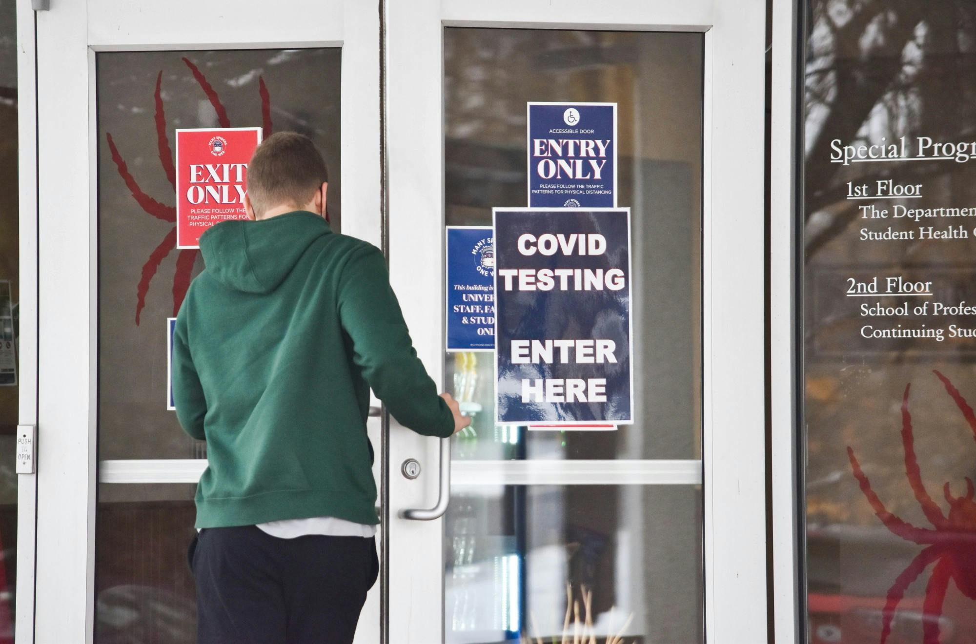 A student enters the Special Programs building in the wake of COVID-19 pandemic.