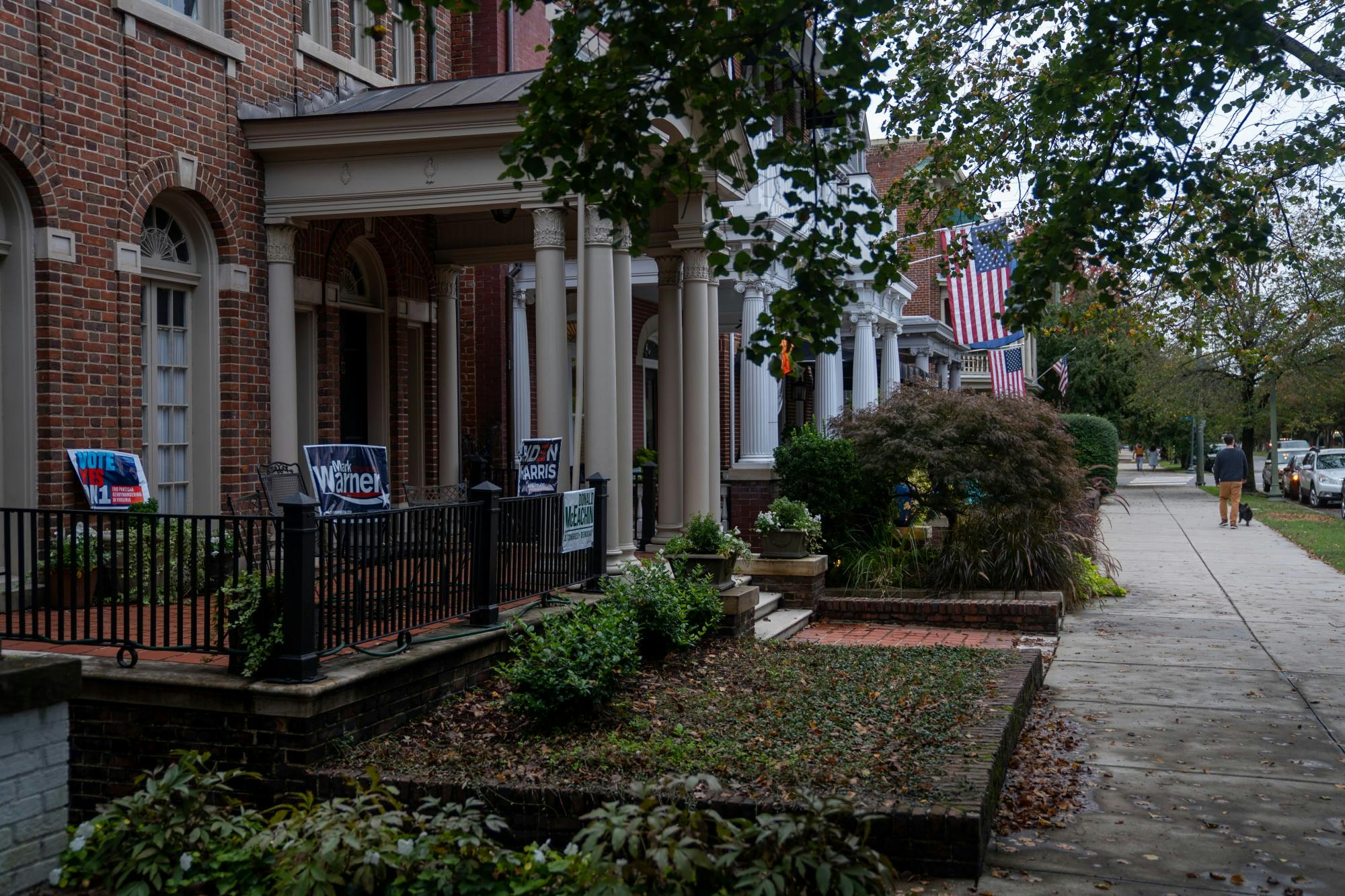 A collage of election signs cover a house on Monument ave.