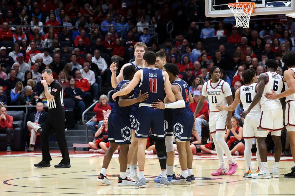 The UR men's basketball team huddles up during its game against the Flyers. Courtesy of Richmond Athletics