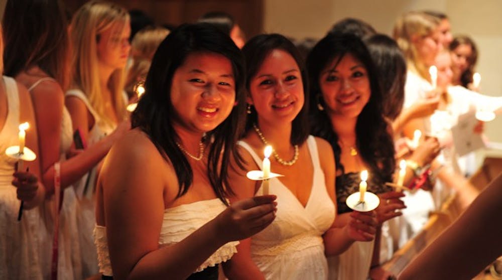 Westhampton Ladies, Class of 2014: Christy Buranaamorn and Rubi Escalona were lighting the candles.