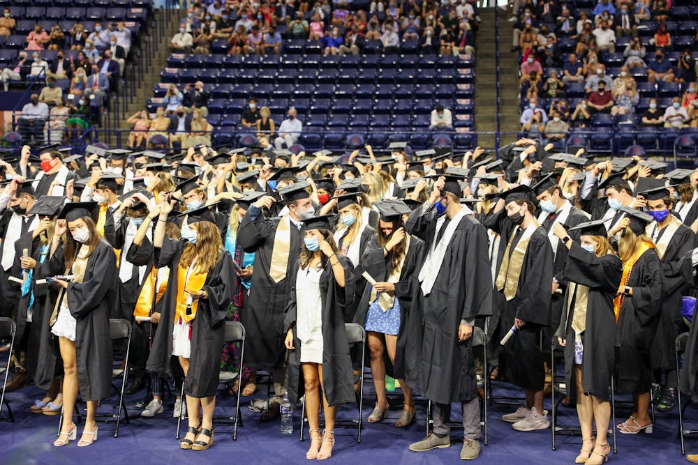 Graduates from the class of 2020 move their tassels from the right to the left side of their caps to signify their graduation.