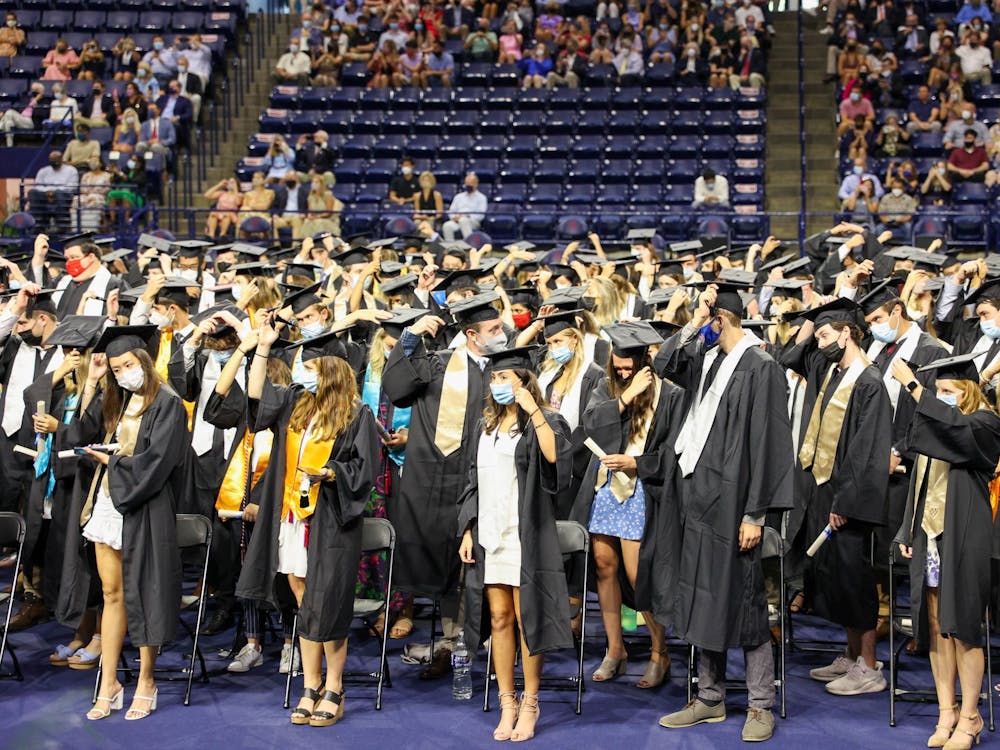 Graduates from the class of 2020 move their tassels from the right to the left side of their caps to signify their graduation.