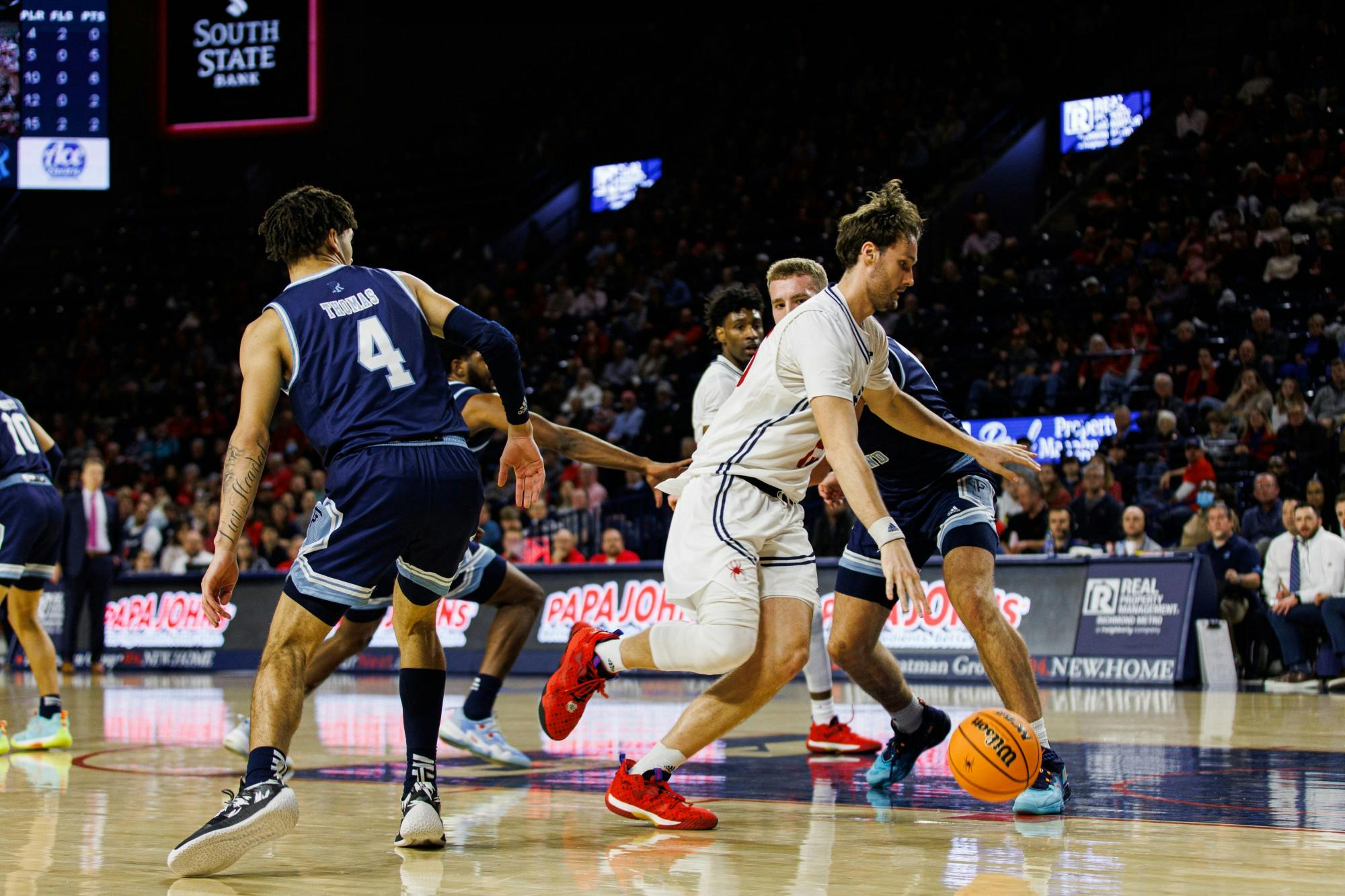 Graduate Forward, Matt Grace drives to the basket for a layup in the first half against Rhode Island.