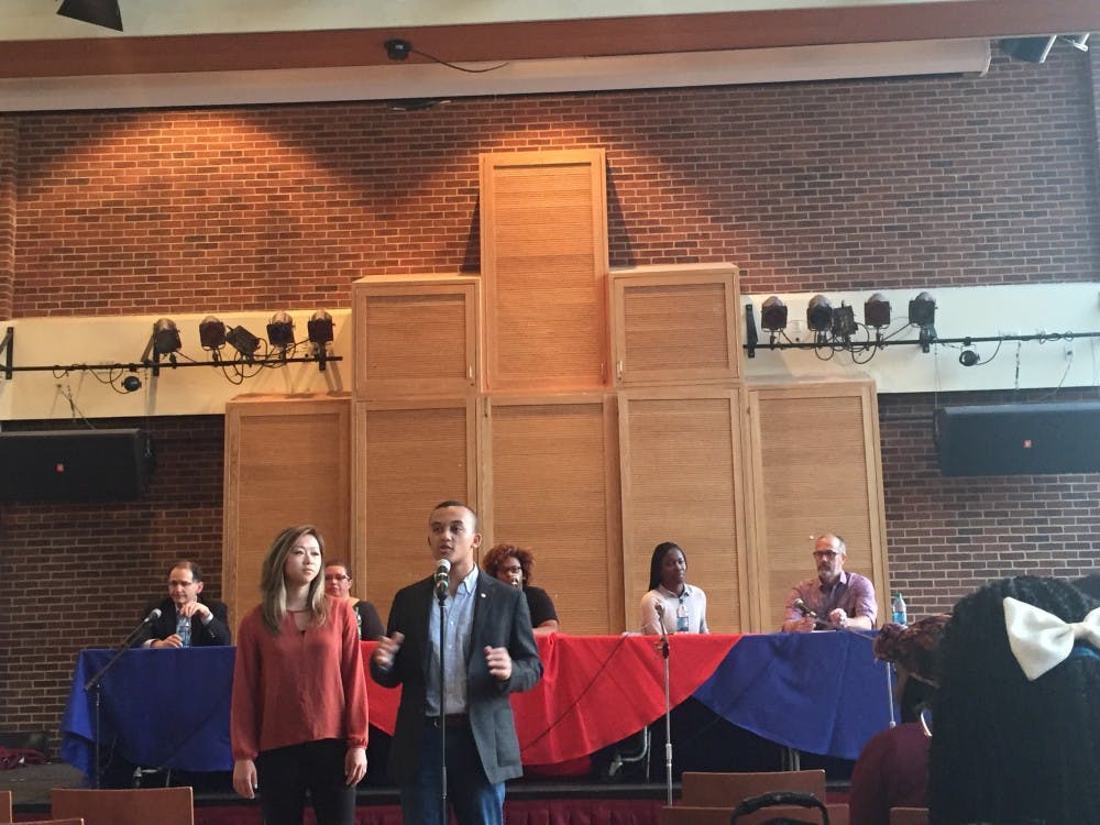 <p>Mia Hagerty, WC '17, and Ken Anderson, RC '17,&nbsp; the current WCGA and RCSGA presidents,&nbsp;introduce the panelists before the forum on race and racism begins.&nbsp;</p>