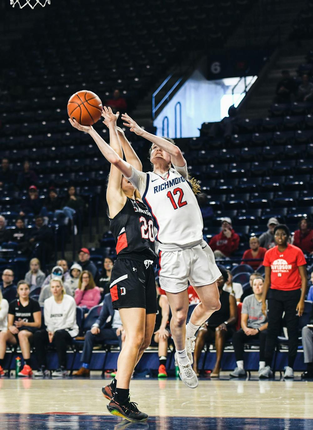 <p>Sophomore guard Claire Holt makes a shot past Davidson defense during a game at the Robins Center on Sunday, Jan. 26, 2020.</p>