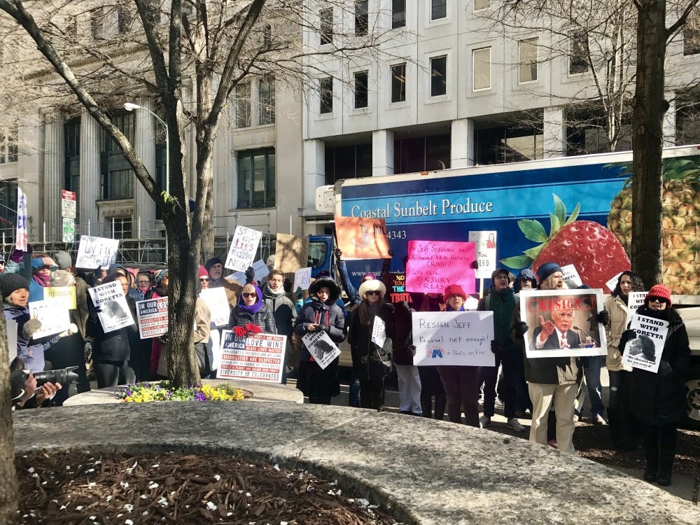 Protesters voiced concern over why Sessions had not chosen to have Wednesday's meeting open to the public. Eventually, the crowd began marching laps around the block.
