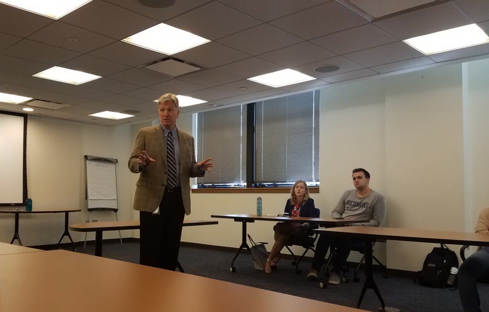 <p>Secretary of Public Safety and Homeland Security Brian J. Moran speaks with students during a UR Downtown seminar on criminal justice.&nbsp;</p>