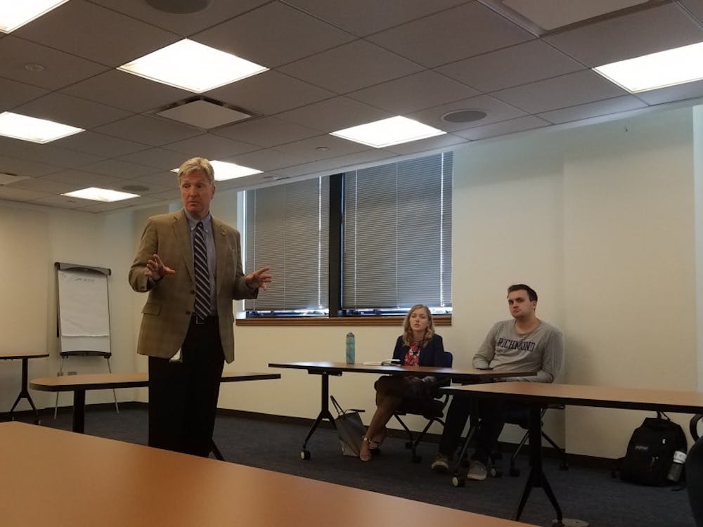 Secretary of Public Safety and Homeland Security Brian J. Moran speaks with students during a UR Downtown seminar on criminal justice.&nbsp;