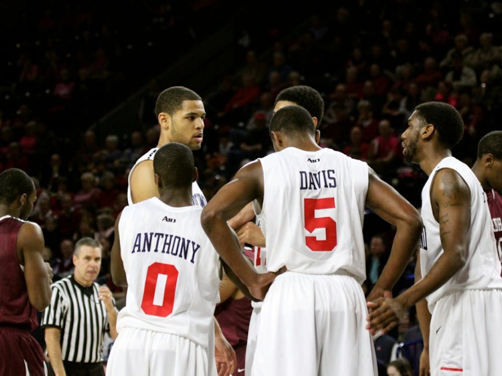 Members or the Richmond Spiders basketball team huddle up during a game against Fordham last season.