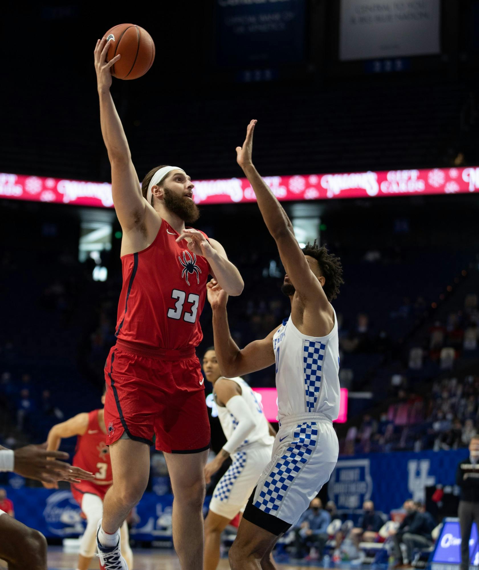 Graduate student forward Grant Golden takes a shot over a defender during a game against Kentucky on Nov. 29 at Rupp Arena in Lexington, Kentucky. Courtesy of Mark Cornelison via SEC Media Portal