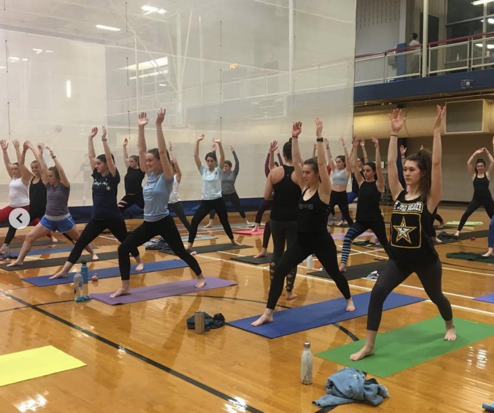 <p>Members of the UR chapter of CHAARG participate in a group yoga class taught by Lunge Yoga in the Weinstein Center for Recreation and Wellness. <em>Photo courtesy of the CHAARG </em><a href="https://www.instagram.com/p/Bt2Rf3onSZf/" target="_blank"><em>Instagram</em></a><em>.&nbsp;</em></p>