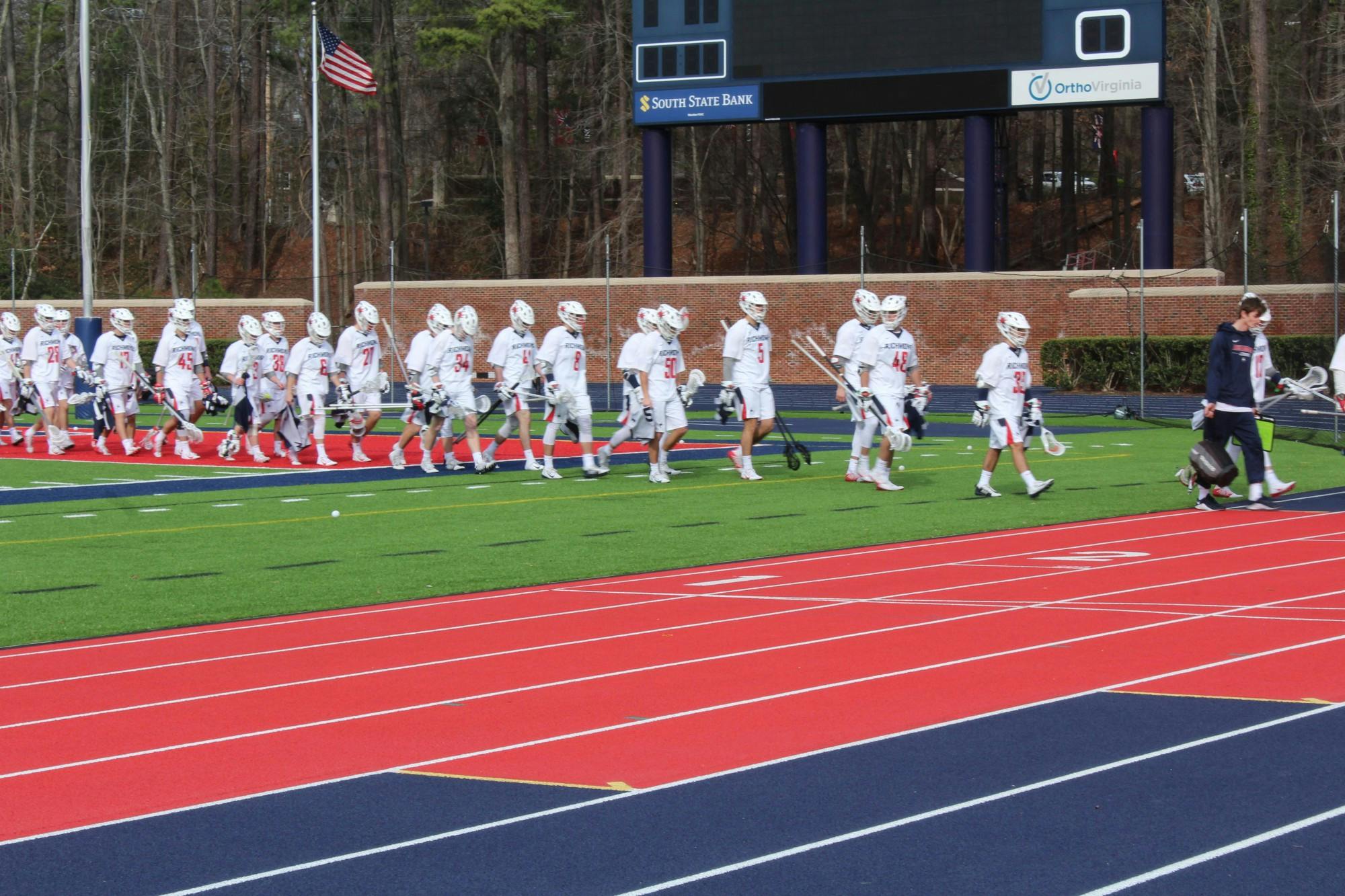 The Richmond Spiders men's lacrosse team walks off the field after the double overtime loss against Maryland on Saturday, heading into the locker room.&nbsp;The game took place on Saturday, Feb. 8, 2020.