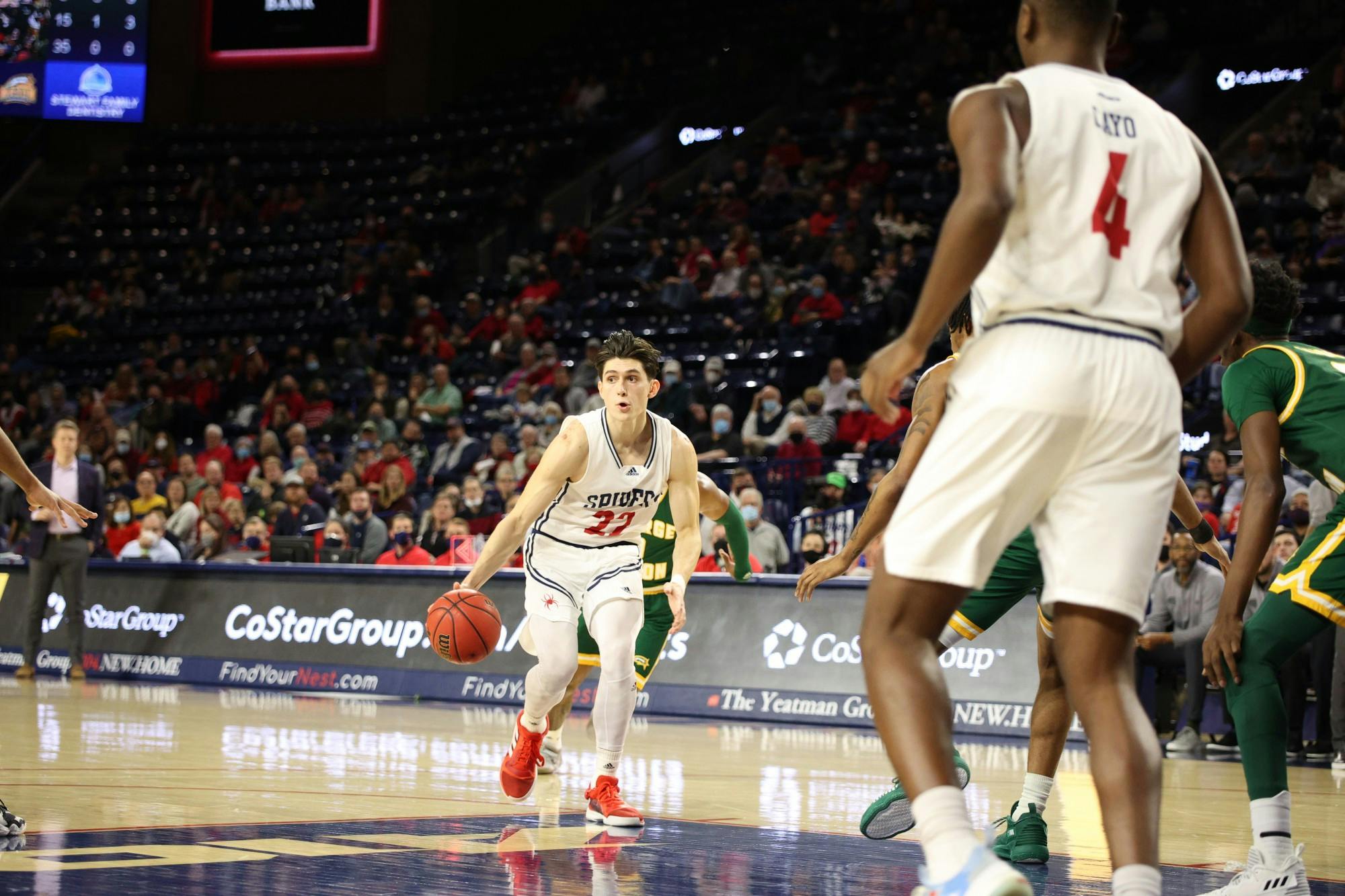Senior guard Andre Gustavson looks for a team member to pass the ball to.