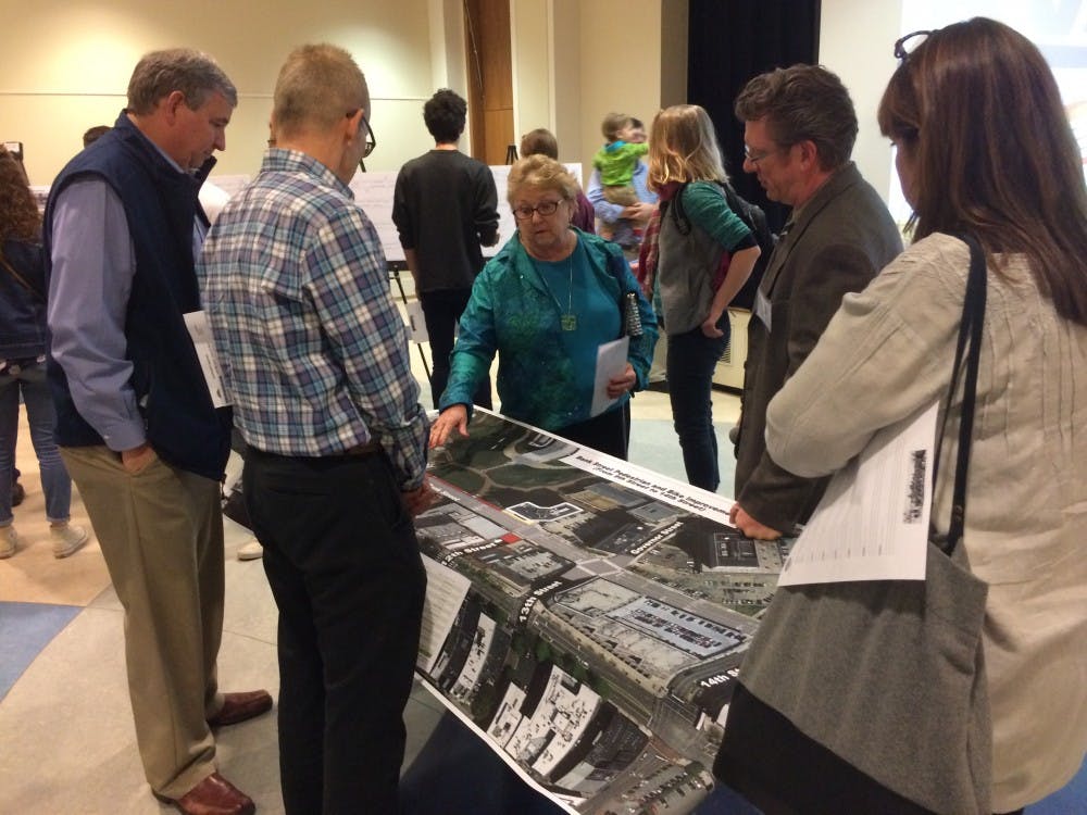 Bike Walk RVA forum attendees&nbsp;look over a map of the new road designs, which plan to&nbsp;construct 25 miles of bike lanes throughout the city of Richmond.