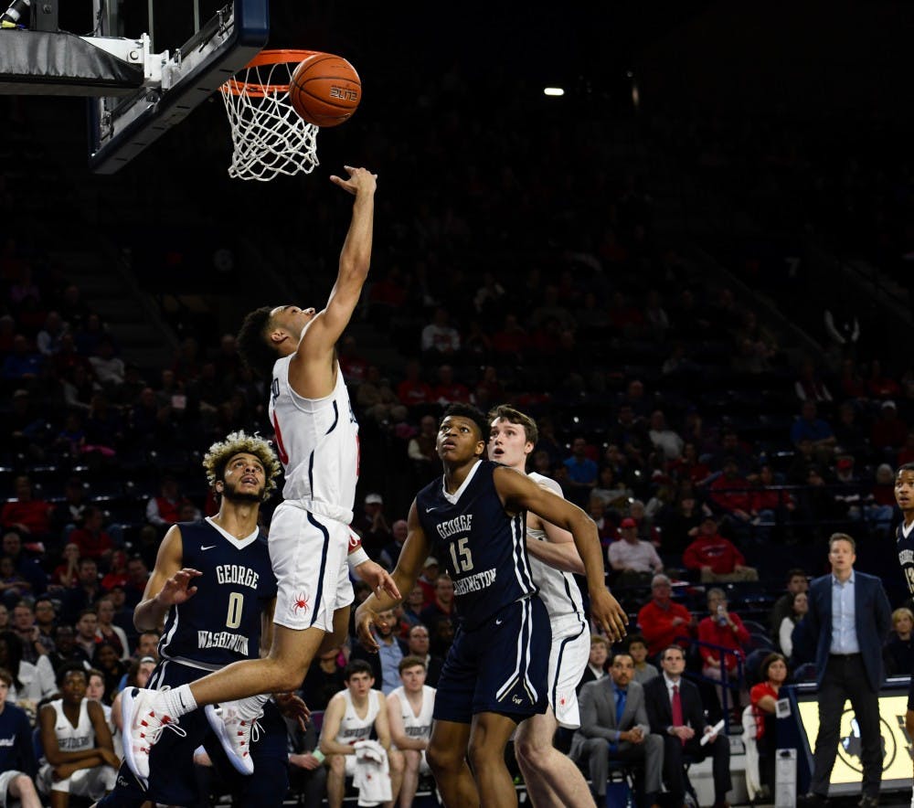 <p>Sophomore guard Jacob Gilyard shoots a layup in a Spider victory over George Washington Saturday night.&nbsp;</p>